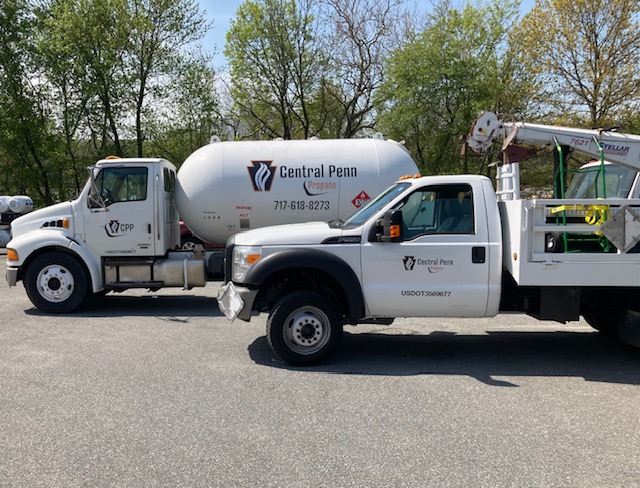 Two trucks providing commercial propane services for residential, commercial properties, and off-road diesel fuel delivery and installation.