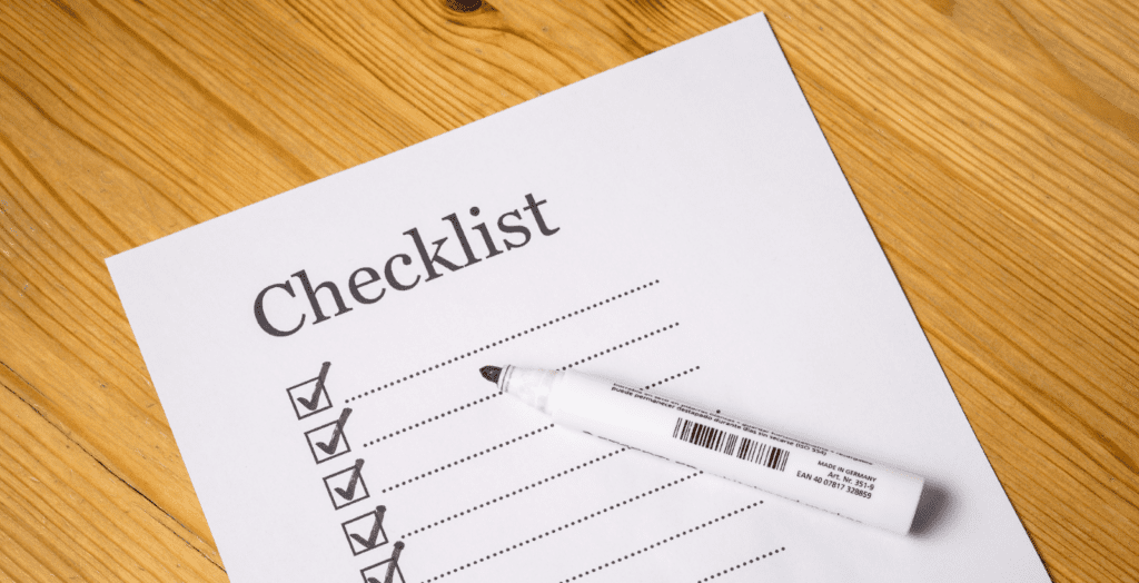 Person holding a safety checklist to ensure proper precautions are followed.
