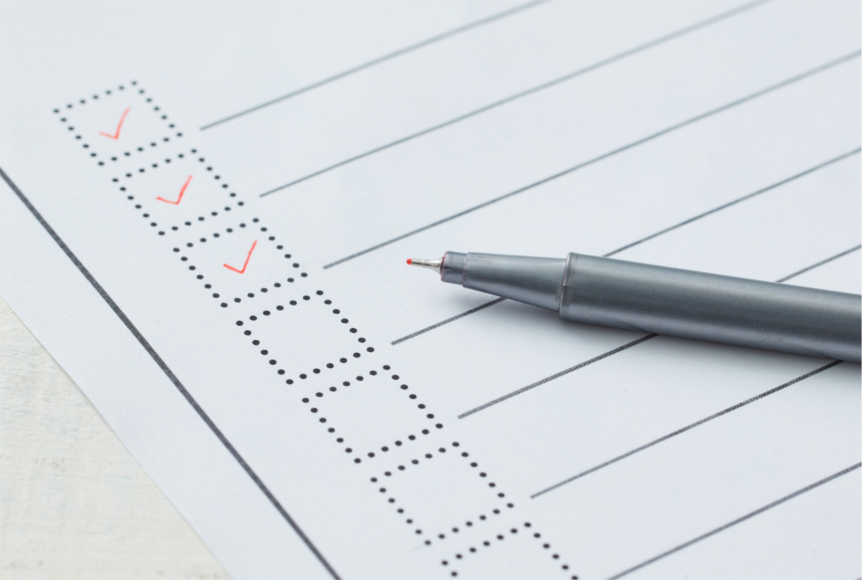 A propane installation check list with a pen placed on top, ready for a technician to mark completed safety steps and installation tasks.