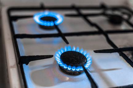 Close-up of a stove pilot light in Lancaster County, powered by propane installation, showing the economic advantages for propane.