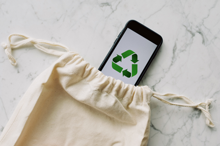 Smartphone screen showing a renewable energy sign, promoting sustainable energy solutions.