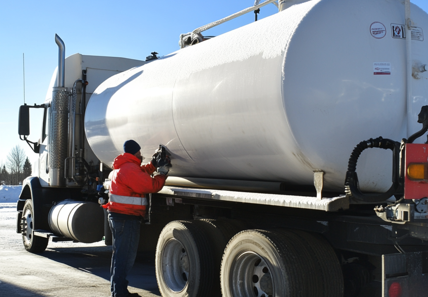 Off-Road Diesel Delivery by truck driver fueling equipment in remote location
